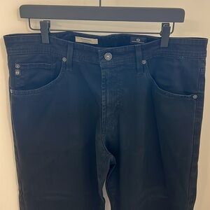AG NWOT Men’s The Graduate tailored leg black jeans.